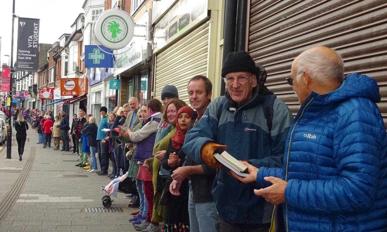 Human chain helps radical bookshop move into old bank